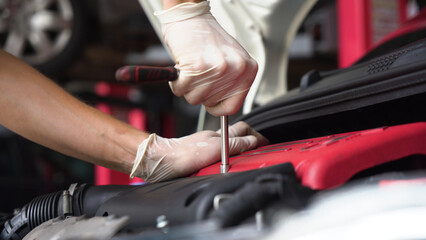 auto mechanic repairs car engine. car service. close-up.