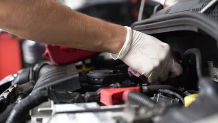 Fototapeta premium auto mechanic repairs car engine. car service. close-up.