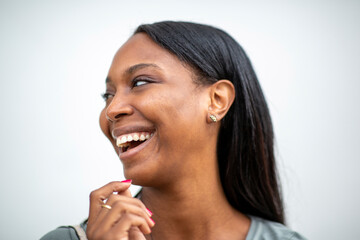 Fototapeta na wymiar Black lady laughing over white background