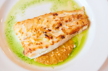 Baked hake dish with two sauces