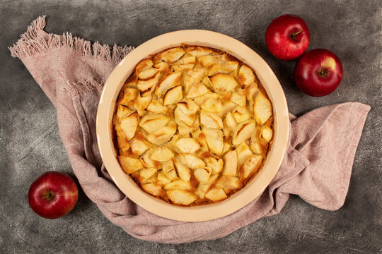 Freshly baked clafoutis pie with apples. Apple pie. Top view.