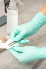 Hand disinfects tweezers with cleaning systems for medical instruments. Ultrasonic cleaner