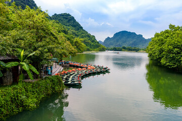View of tourist boats station in Trang An, Ninh Binh province ,Vietnam. It is an Unesco world...