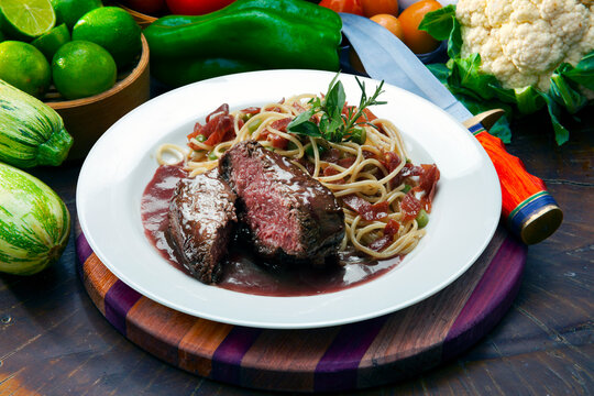 Roasted steak with sauce and pasta