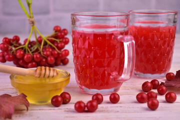 Fototapeta na wymiar Useful tea from viburnum berries and honey. 