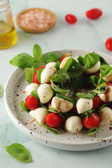 A plate with Italian salad caprese canape