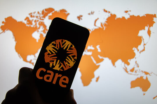 Rheinbach, Germany  1 April 2022,  The brand logo of the aid organization "Care International" on the display of a smartphone (focus on the brand logo)