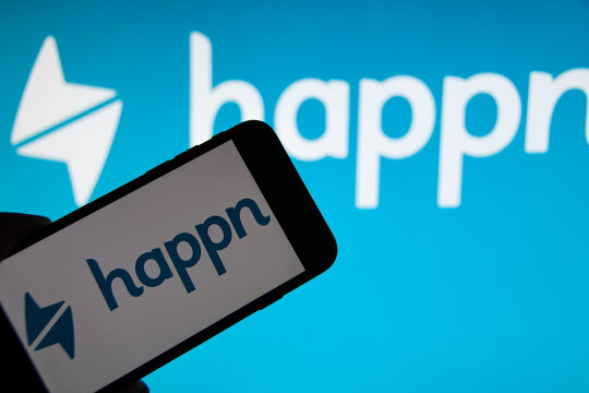 Rheinbach, Germany  3 December 2021,  The brand logo of the online dating platform "Happn" on the display of a smartphone (focus on the brand logo)