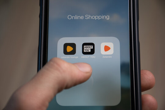 RHEINBACH , GERMANY 06 November , 2020   People when shopping online with their smartphone for popular apps such as Zalando and About You. Online shopping is booming during the Corona crisis