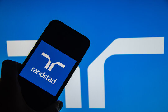 Rheinbach, Germany  8 August 2022,  
The brand logo of the Dutch company "Randstad" on the display of a smartphone (focus on the brand logo)