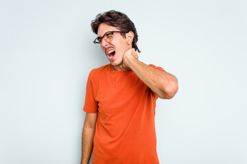 Young hispanic man isolated on blue background suffering neck pain due to sedentary lifestyle.