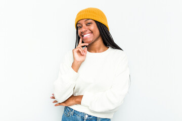 Young African American woman isolated on white background smiling happy and confident, touching chin with hand.