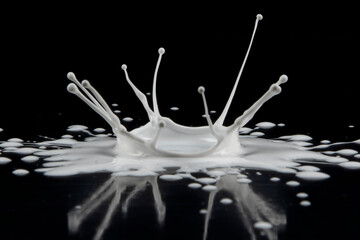 Drop of white paint on Black background