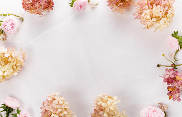 Autumn creative composition roses, hydrangea flowers on gray background. Fall, autumn background. Flat lay, top view, copy space