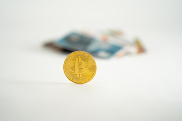 bitcoins on a white background with credit cards