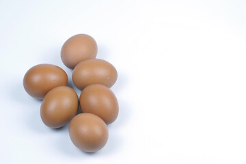 Small group of Chicken eggs on white background. Top view