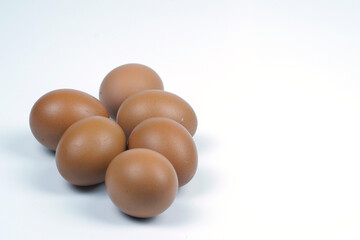Small group of Chicken eggs on white background. Top view