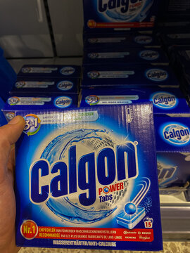 Rheinbach, Germany  14 October 2021,  A pack of Calgon Power Tabs in a customer's hand in front of the shelf of a supermarket