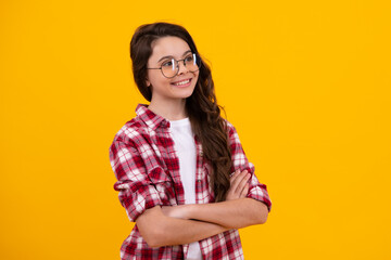 Happy teenager, positive and smiling emotions of teen girl. Portrait of teenager girl crossed arms...