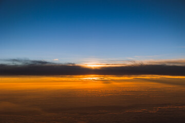 Sunset view from an airplane passenger seat