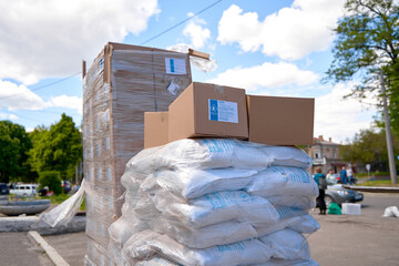 Humanitarian food aid unloaded in front of humanitarian centre