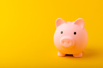 Piggy bank on a yellow background.The concept of investment and saving money.Investments.Place of milking text. Place to copy. mockup