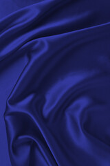 Rich and luxury red silk fabric texture background.