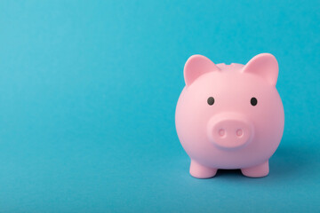 Piggy bank on a blue background.The concept of investment and saving money.Investments.Place of milking text. Place to copy. mockup