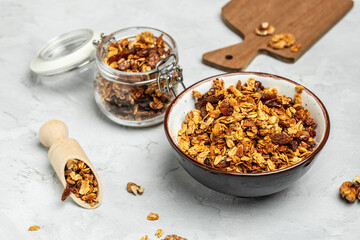 Bowl with granola on a light background. superfood concept. Healthy, clean eating. Vegan or gluten free diet. Long banner format. top view