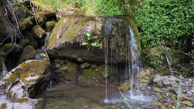 View of Cascade Aguasaliu, a waterfall in Vidosa, Asturias, Spain. Reduced stream flow because of drought.