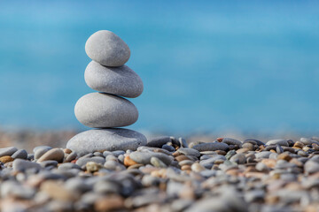 Fototapeta na wymiar pebble tower on beach in Nice
