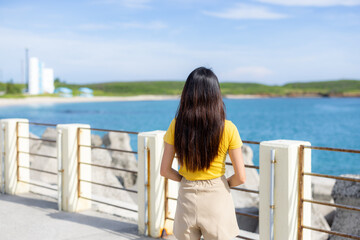 Fototapeta na wymiar Tourist woman look at the sea in Penghu of Taiwan