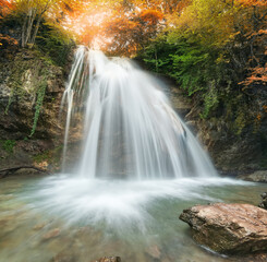 Fototapeta premium Spring waterfall flow.