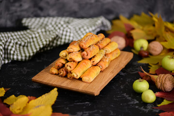 Pumpkin shortbread rolled cookies with apple filling.
