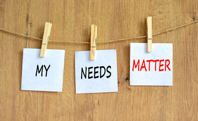 My needs matter symbol. Concept words My needs matter on white papers on wooden clothespins. Beautiful wooden background. Business, psychological and my needs matter concept. Copy space.