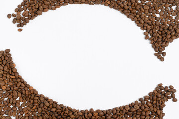 Circle frame of coffee beans isolated on white background, example for advertising.