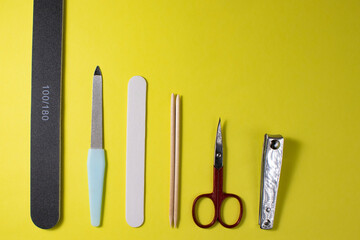 manicure tools on a light background scissors nail files