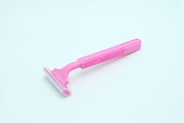 pink razor isolated on white background