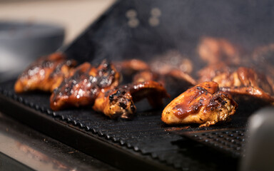 Grilling chicken in summer weather