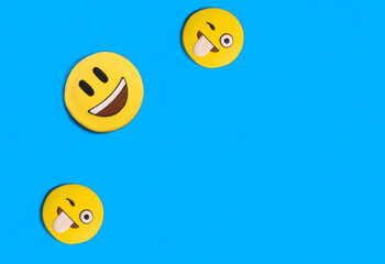 Smileys in the form of gingerbread on the blue background.Top view. Copy space.