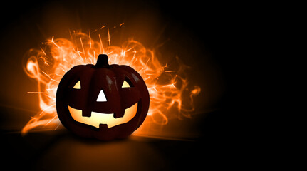 Halloween composition of a burning pumpkin 