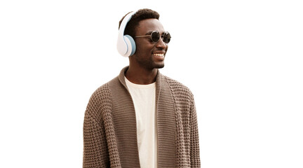 Portrait of happy smiling african man in wireless headphones listening to music looking away isolated on white background