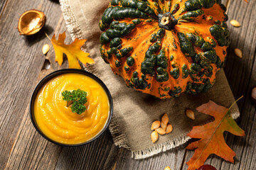 pumpkin soup and raw pumpkin in fall