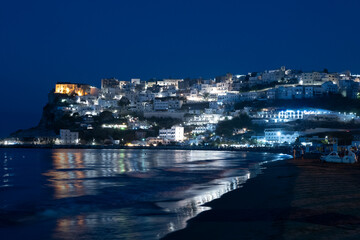 Night view of the town of Peschici from the beach