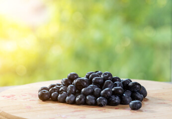 Blueberry on wooden plate
