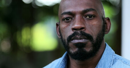 Fototapeta premium Confident black man portrait face close-up. African person