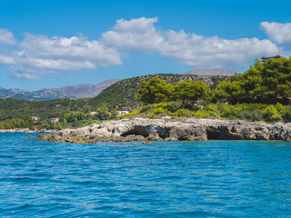 Beautiful beach with stone caves in Greece