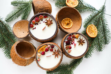 original christmas candle in coconut and fir branches	
