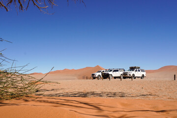 Fototapeta na wymiar Trucks in desert