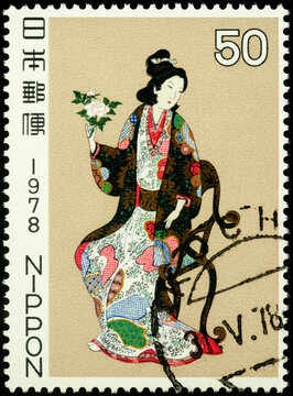 Seated Woman With Flower on postage stamp